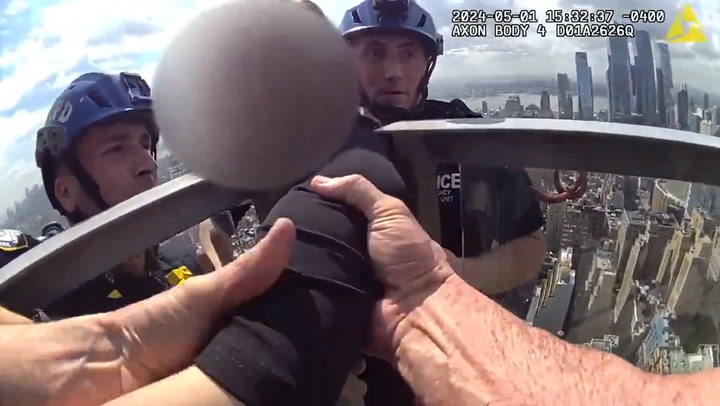 Watch: NYPD scale side of skyscraper to rescue woman 54-stories in air | News [Video]