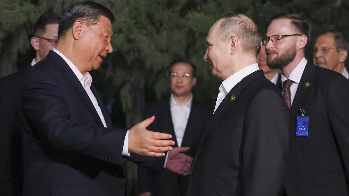 Putin and Xi’s bromance continues as Chinese leader awkwardly HUGS Vladimir in growing sign that their two nations are more united than ever as they seek to topple US-led world order [Video]