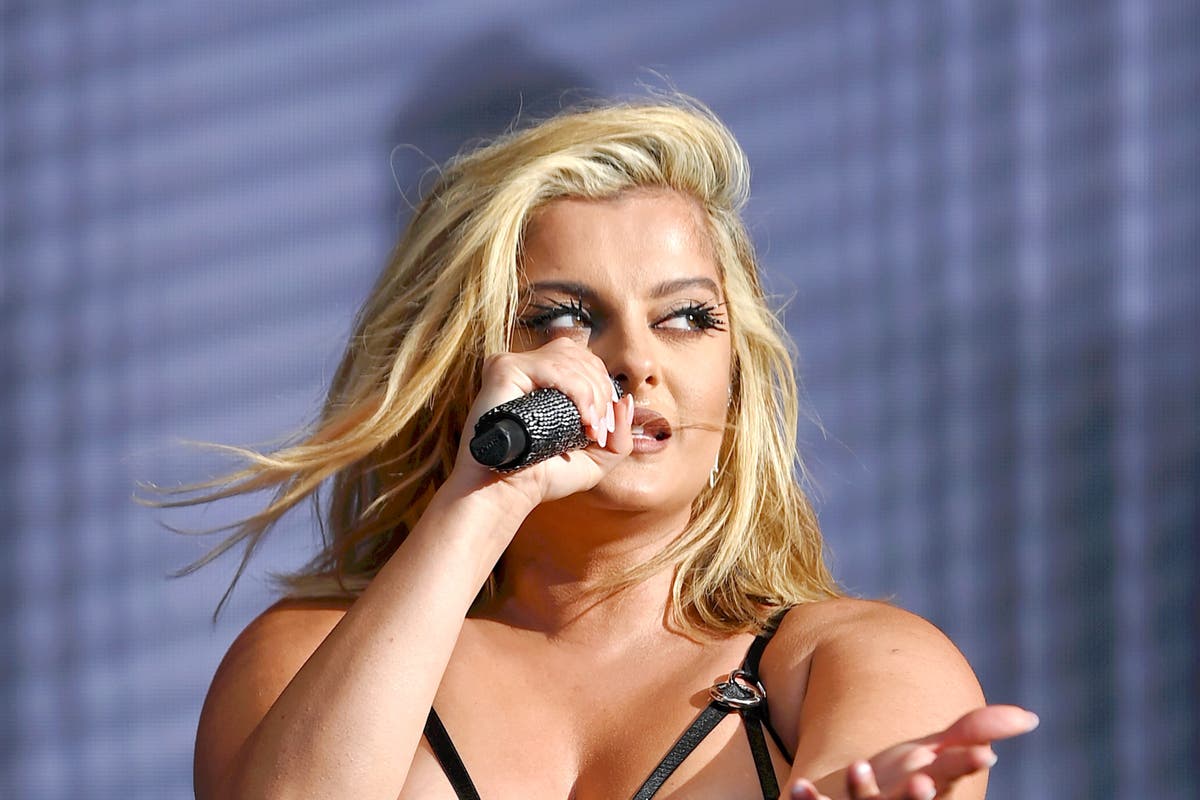 Bebe Rexha unloads on fan who attempted to throw something at her on stage [Video]