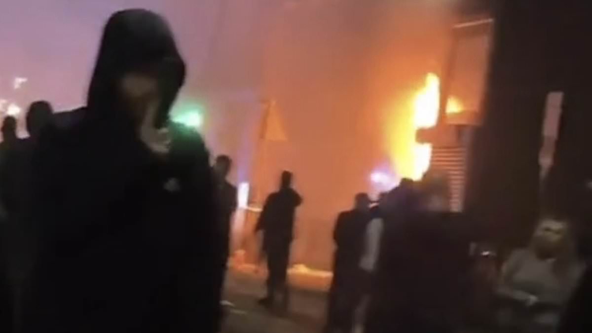 Shameless thugs set a library and foodbank ablaze, target middle eastern cafes and set fire to looted shops as anarchy descends in flashpoints across Liverpool, Hull, Manchester and Belfast – with more violence expected today [Video]