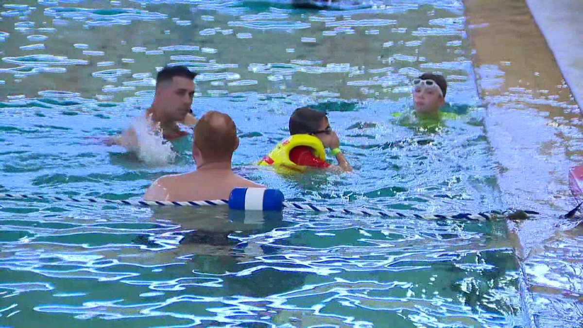 Children with autism, special needs learn water safety at state police pool [Video]