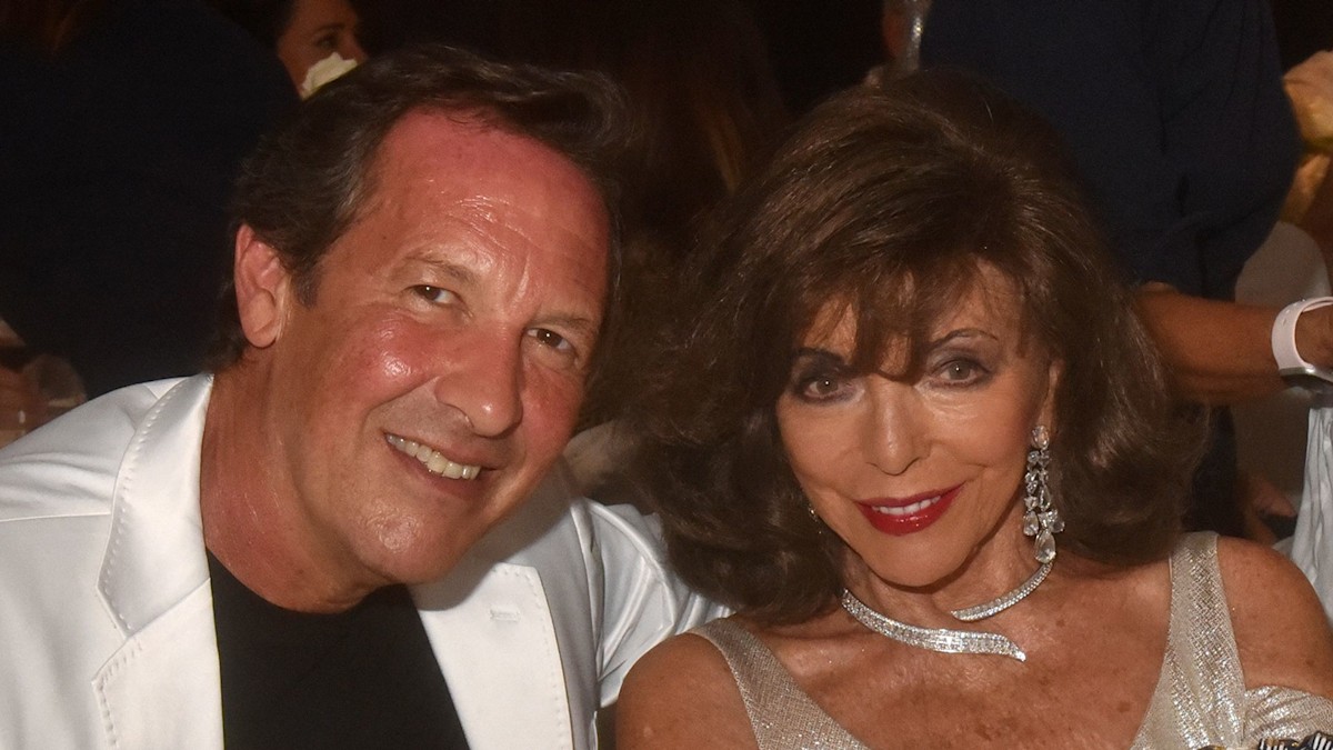 Joan Collins, 91, dazzles in daring silver dress as she joins husband Percy Gibson, 59, at lavish bash [Video]