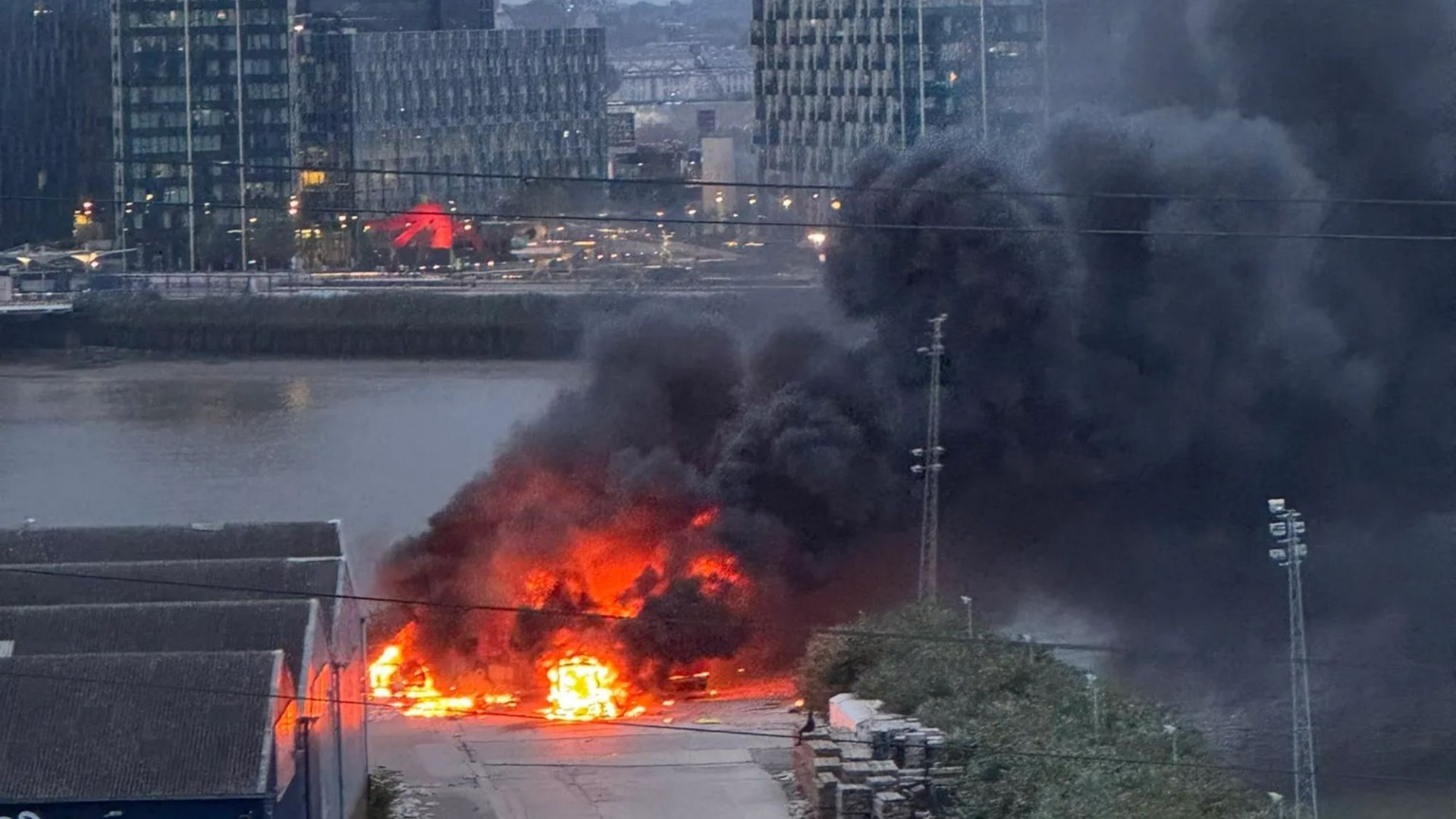 Huge fire erupts near O2 in London after ‘pre-planned explosion’ at film set ‘spreads out of control’ & destroys lorry [Video]