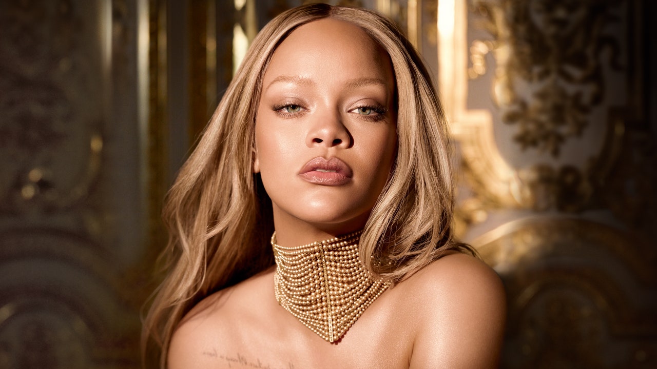 Rihanna Embodies the Iconic J’adore Dior Perfume Bottle in a Golden Corset Dress [Video]