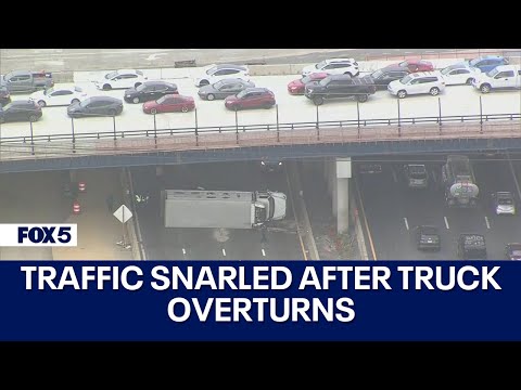 TRAFFIC SNARLED AFTER TRUCK CRASHES, OVERTURNS ON I-495 [Video]