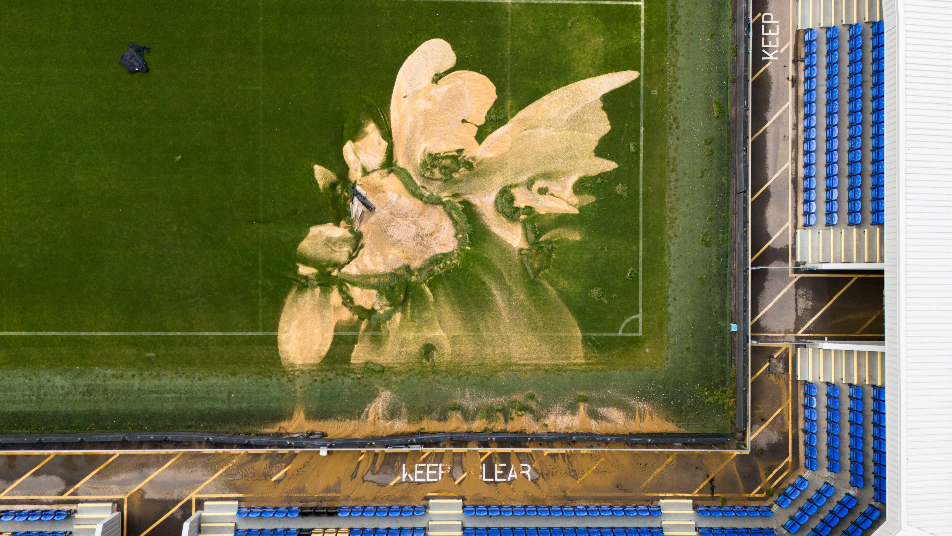 Premier League club’s Carabao Cup clash POSTPONED over flooding as stadium appears to have ‘SINKHOLE’ in pitch [Video]