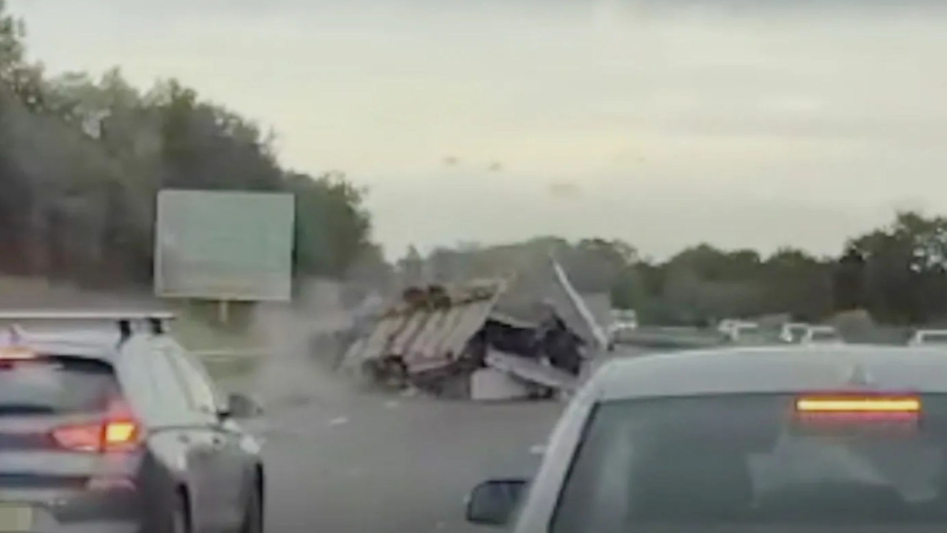 Shocking moment trailer full of FRIDGES crashes on M5 sending debris flying in front of drivers forced to hit brakes [Video]