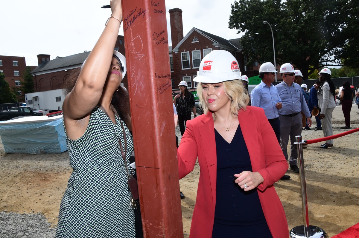 Collaborative early childhood center celebrates success with beam signing [Video]