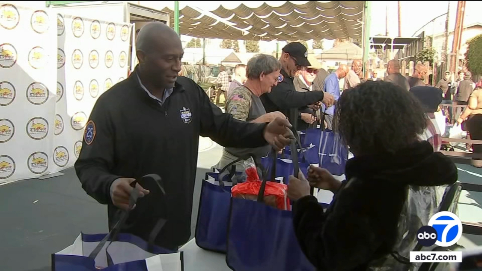 Rams players marking 25th anniversary of 1999 season Super Bowl win help give away turkeys in South Los Angeles [Video]