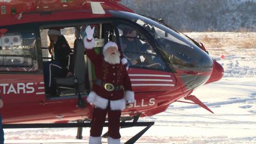 Santa lands at Alberta Childrens Hospital in a helicopter [Video]