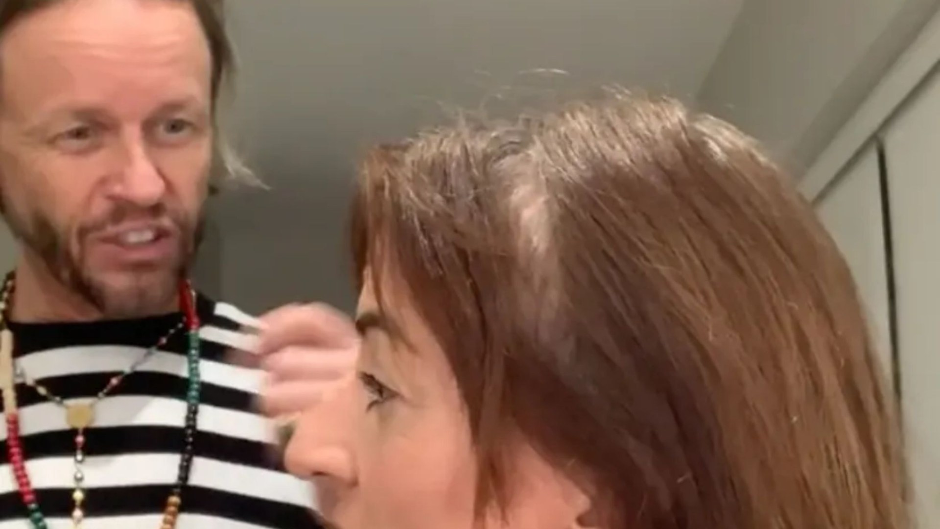 Davina McCall reveals her scar after brain tumour surgery as boyfriend Michael Douglas cuts her hair [Video]