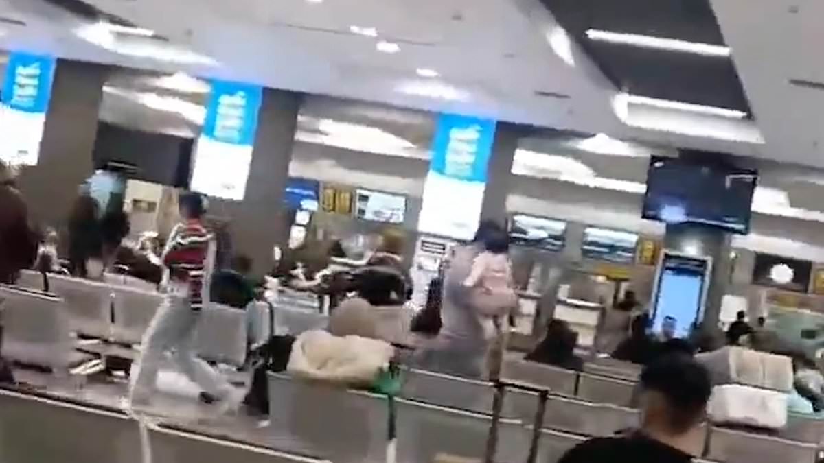 Moment brave Iranian woman tears off cleric’s turban and drapes it over her head in act of defiance after he scolded her for not wearing hijab at Tehran’s international airport [Video]